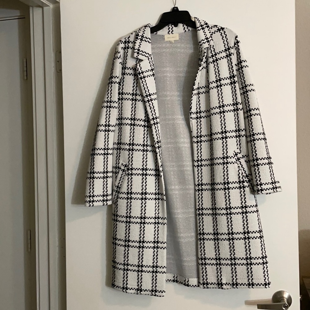 Black and white coat made for styling not to keep you warm. Worn once
